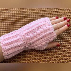 Crocheted pair of fingerless gloves. Pale pink. Fits teen/small adult
